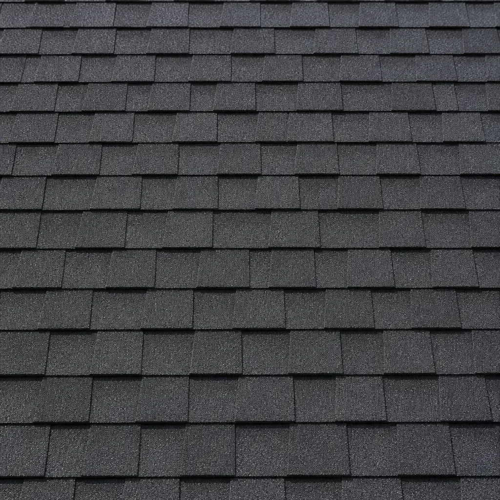 Roofer repairing a storm-damaged section of shingles